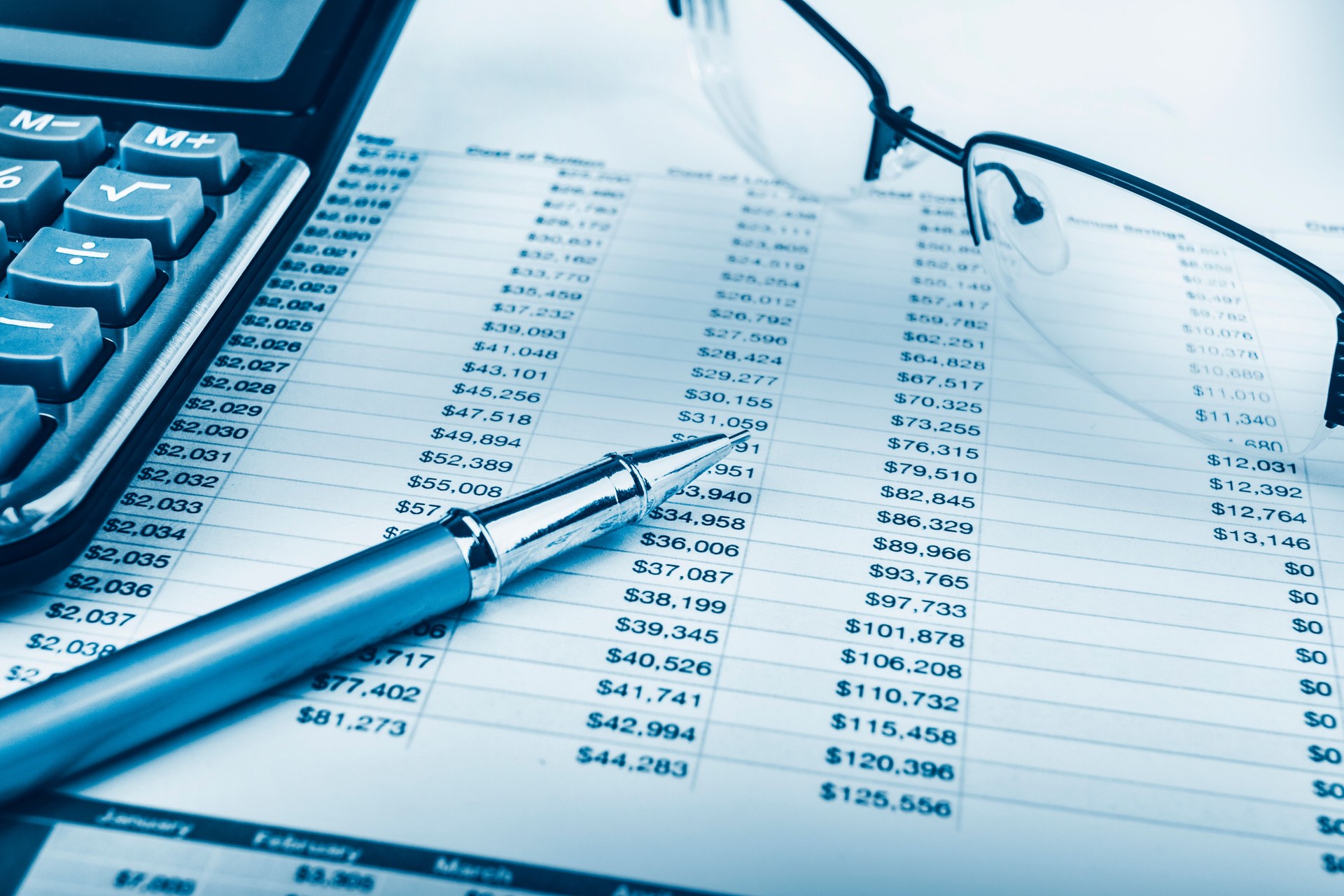 Analysing data, pen, calculator, spectacles and graphs