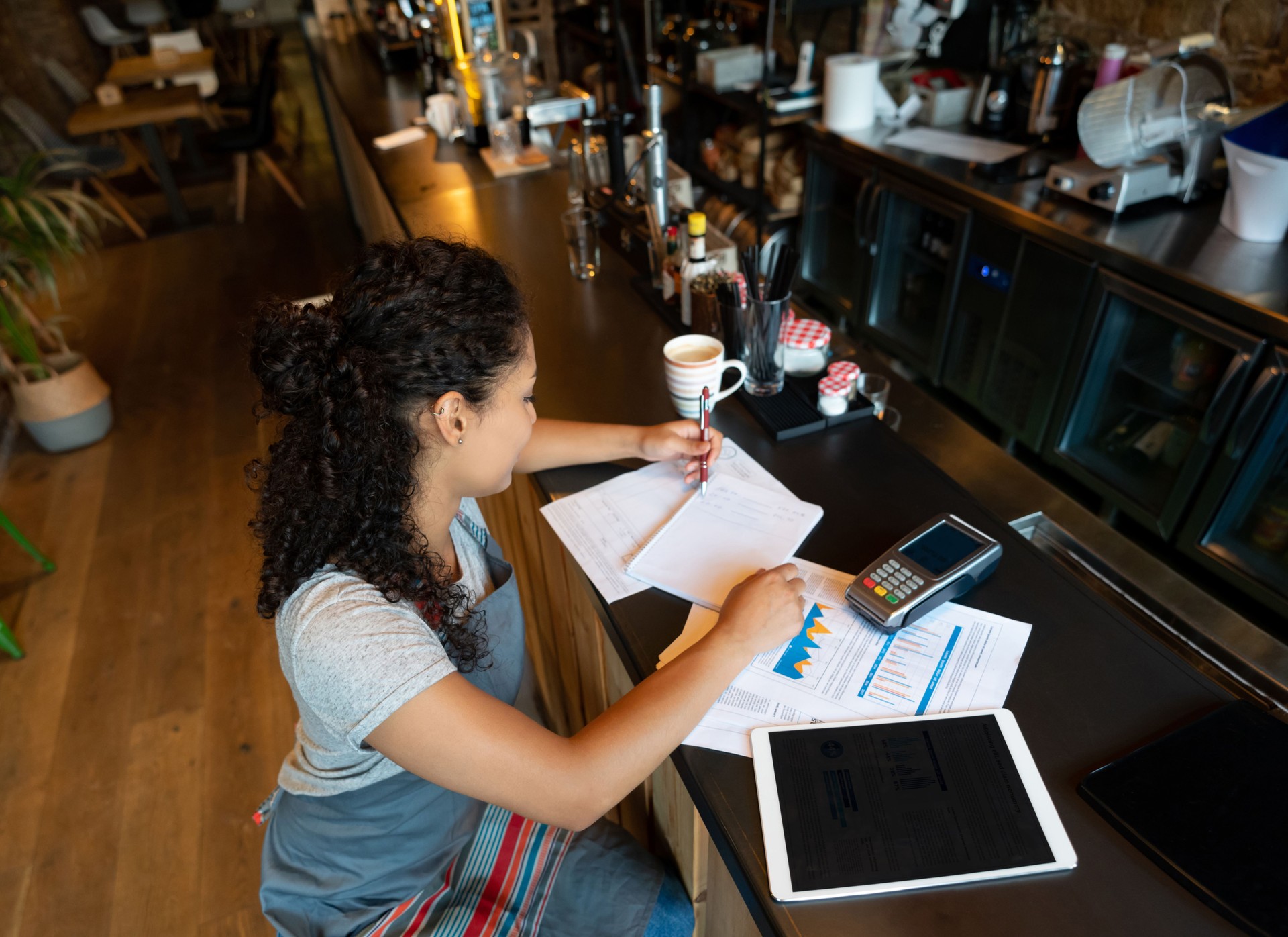 Business manager doing the books at a coffee shop